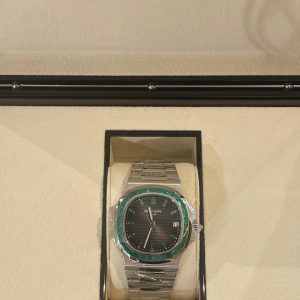 Patek Philippe Nautilus 40.5mm 5711/113P-001 Platinum With Emerald Baguette Bezel - Exotic Boutique Dubai